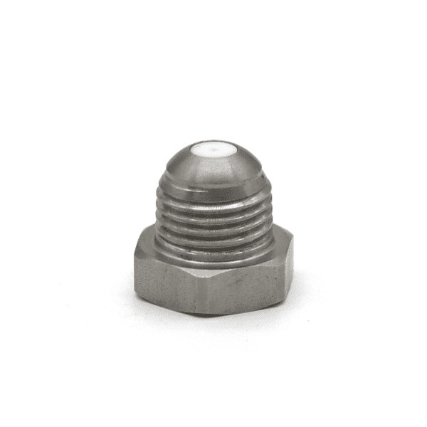 Spray nozzles used for paper machine wire and fabric cleaning in pulp and paper manufacturing